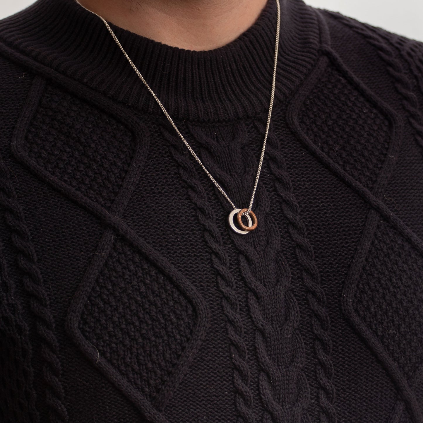 Tom wearing the copper and silver link necklace.