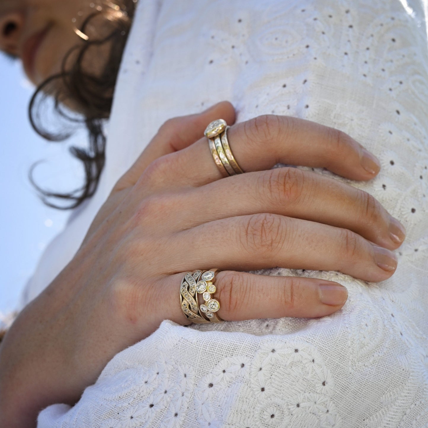 Madeleine wearing the yellow gold celtic diamond promise ring on her little finger.