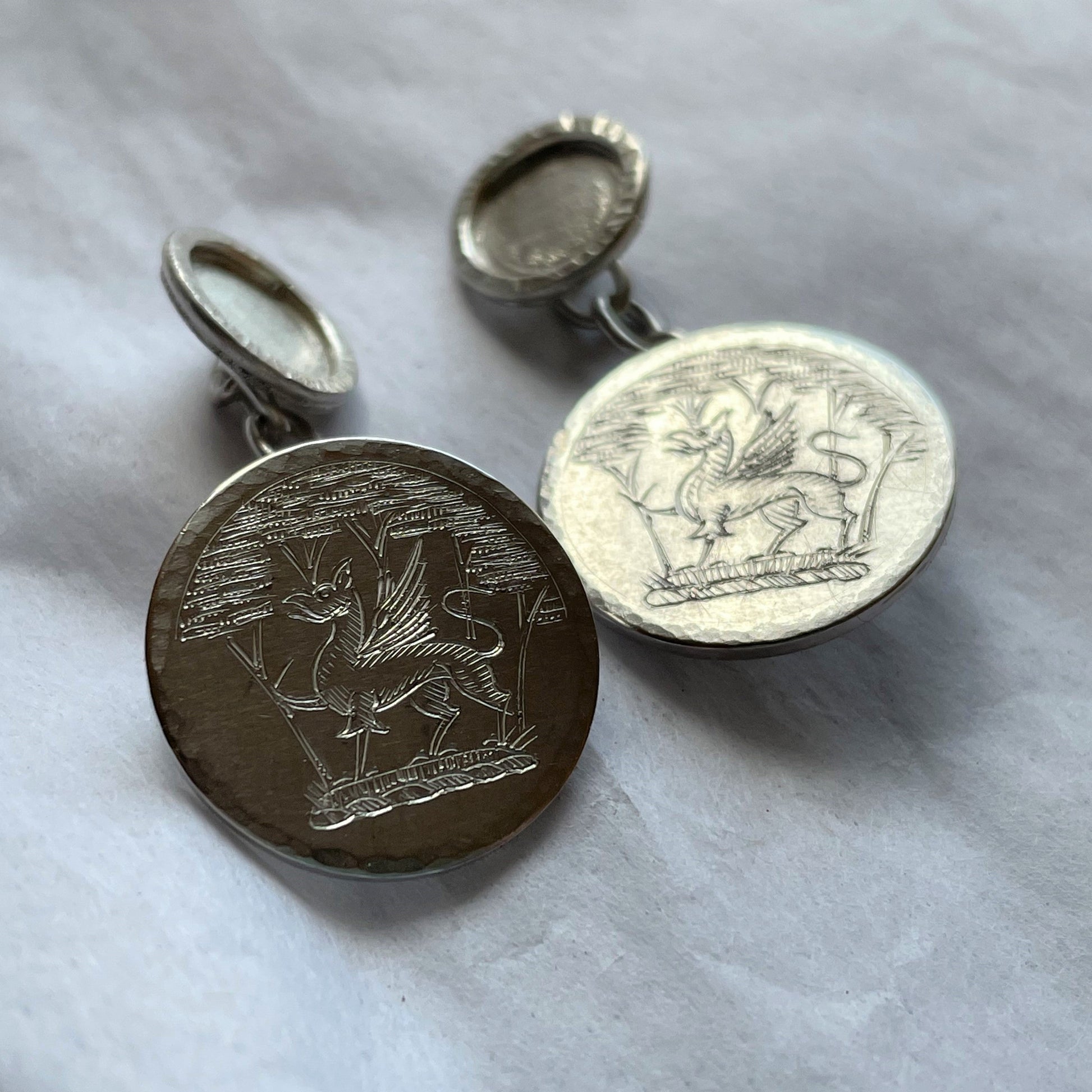 Hand engraved sterling silver cufflinks with family crest, handmade fine jewellery by Madeleine.