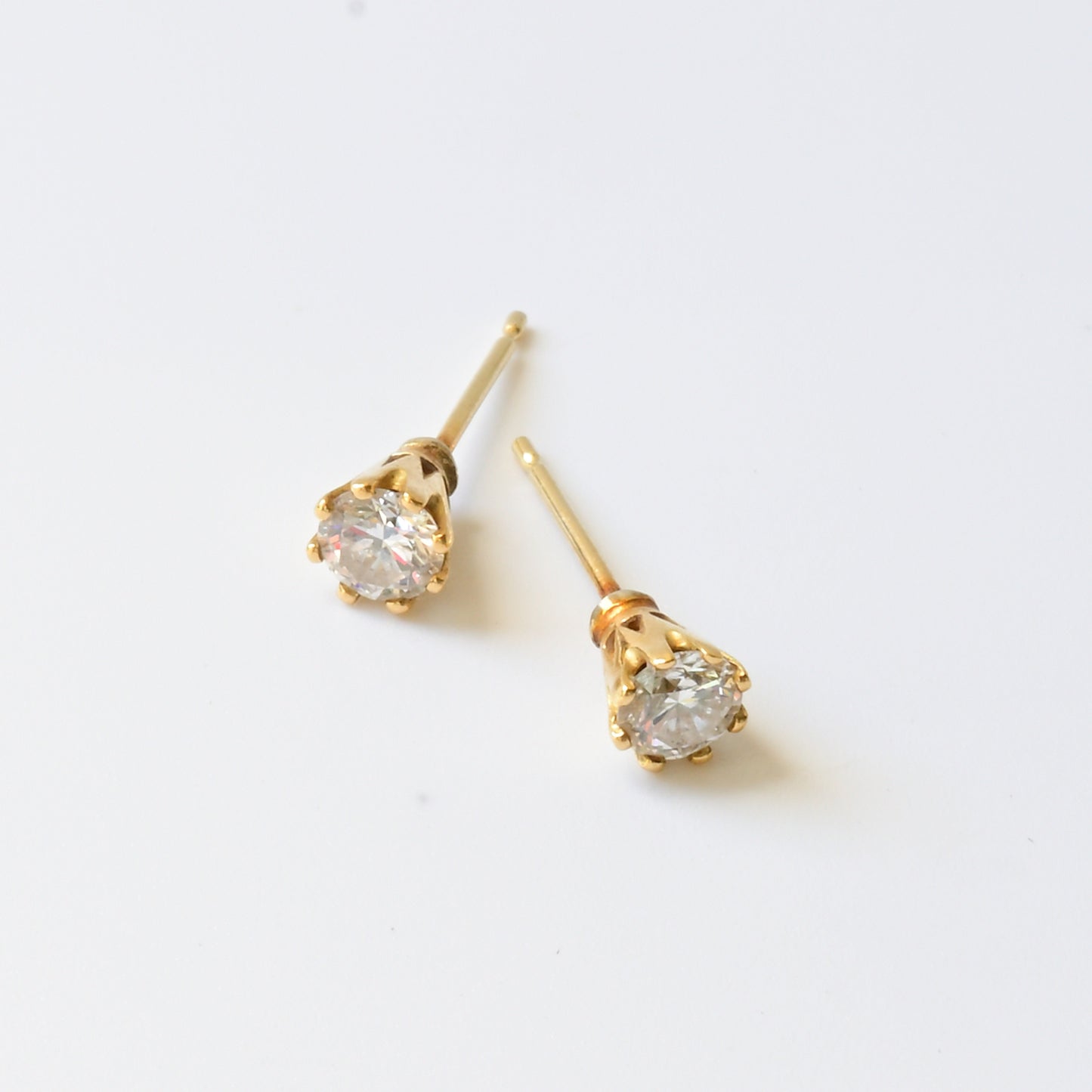 18ct yellow gold and diamond stud earrings, pictured on white. Handmade fine jewellery by Madeleine.