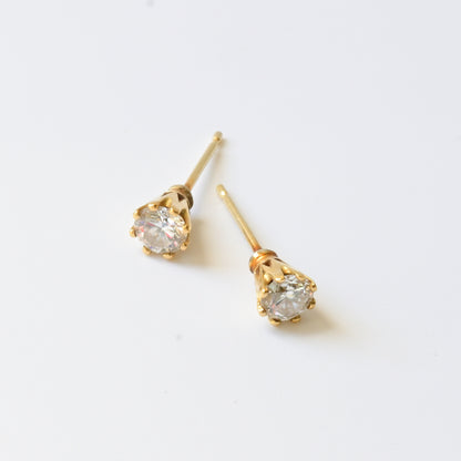 18ct yellow gold and diamond stud earrings, pictured on white. Handmade fine jewellery by Madeleine.