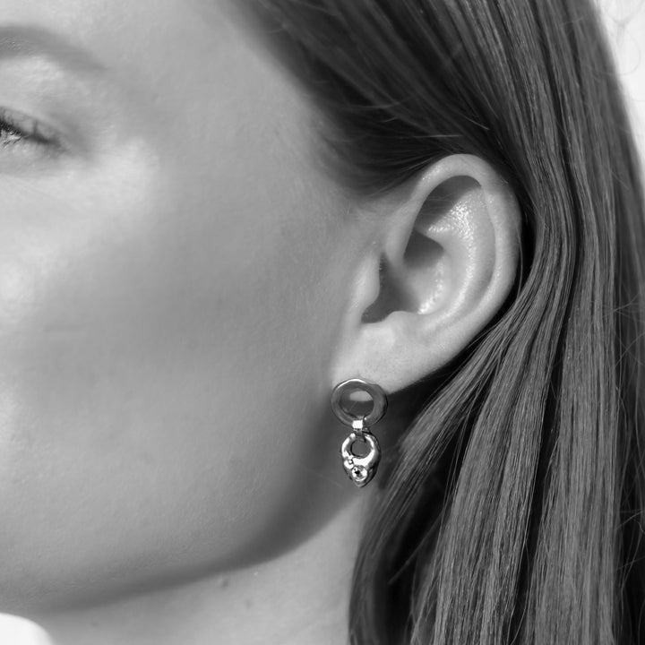 black and white photo of earrings