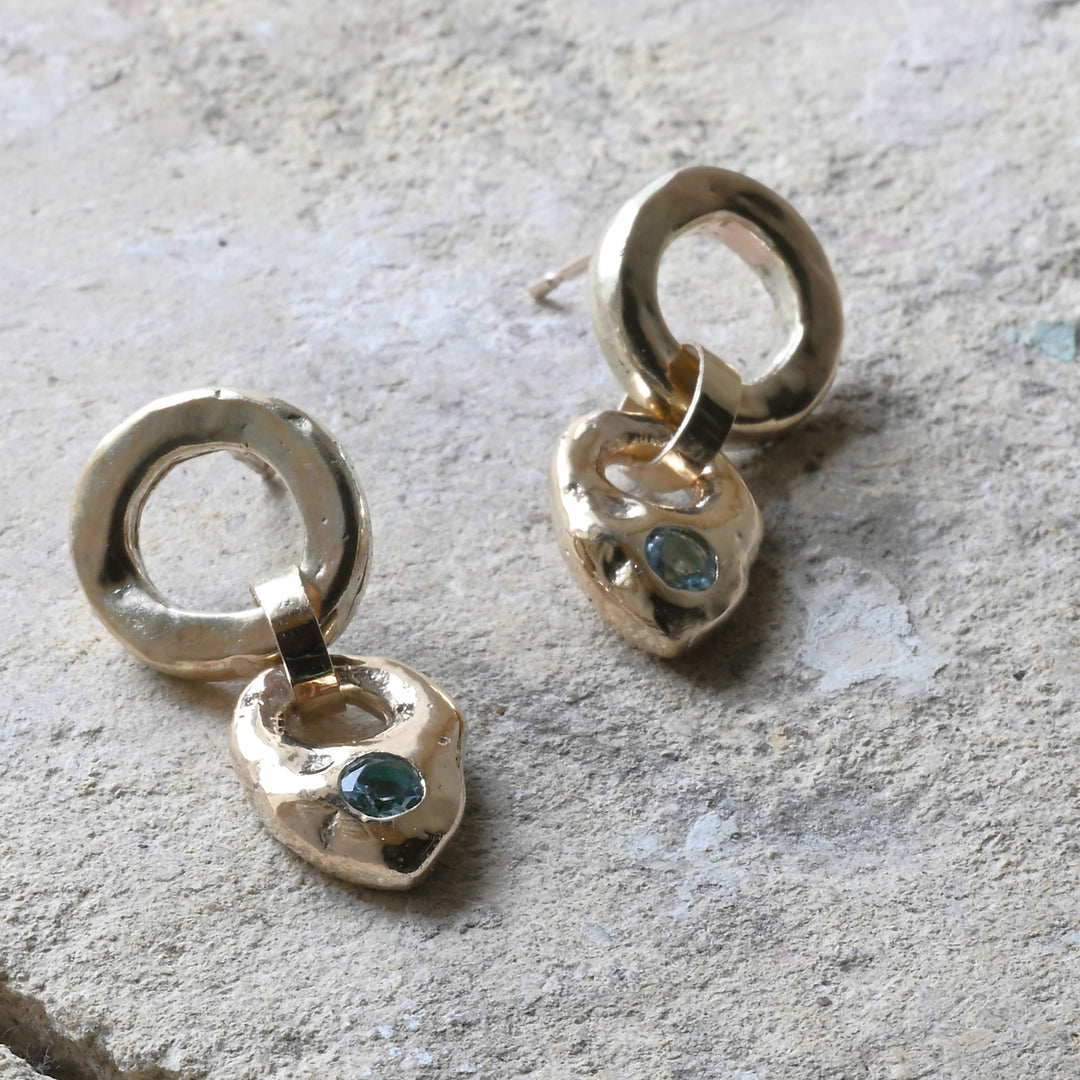 gold aquamarine drops on cotswold stone