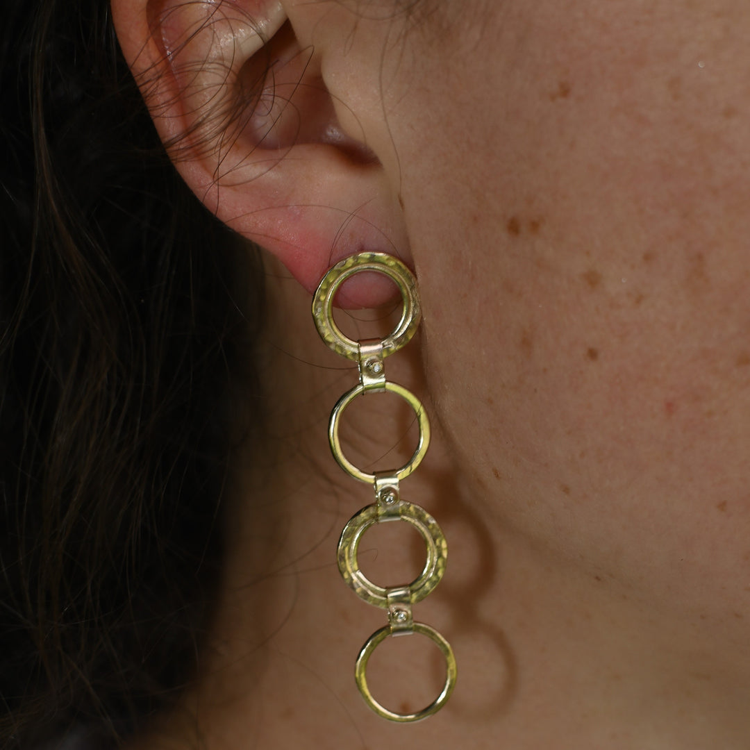 gold circle earrings with diamonds pictured on Madeleine. Handmade fine jewellery.
