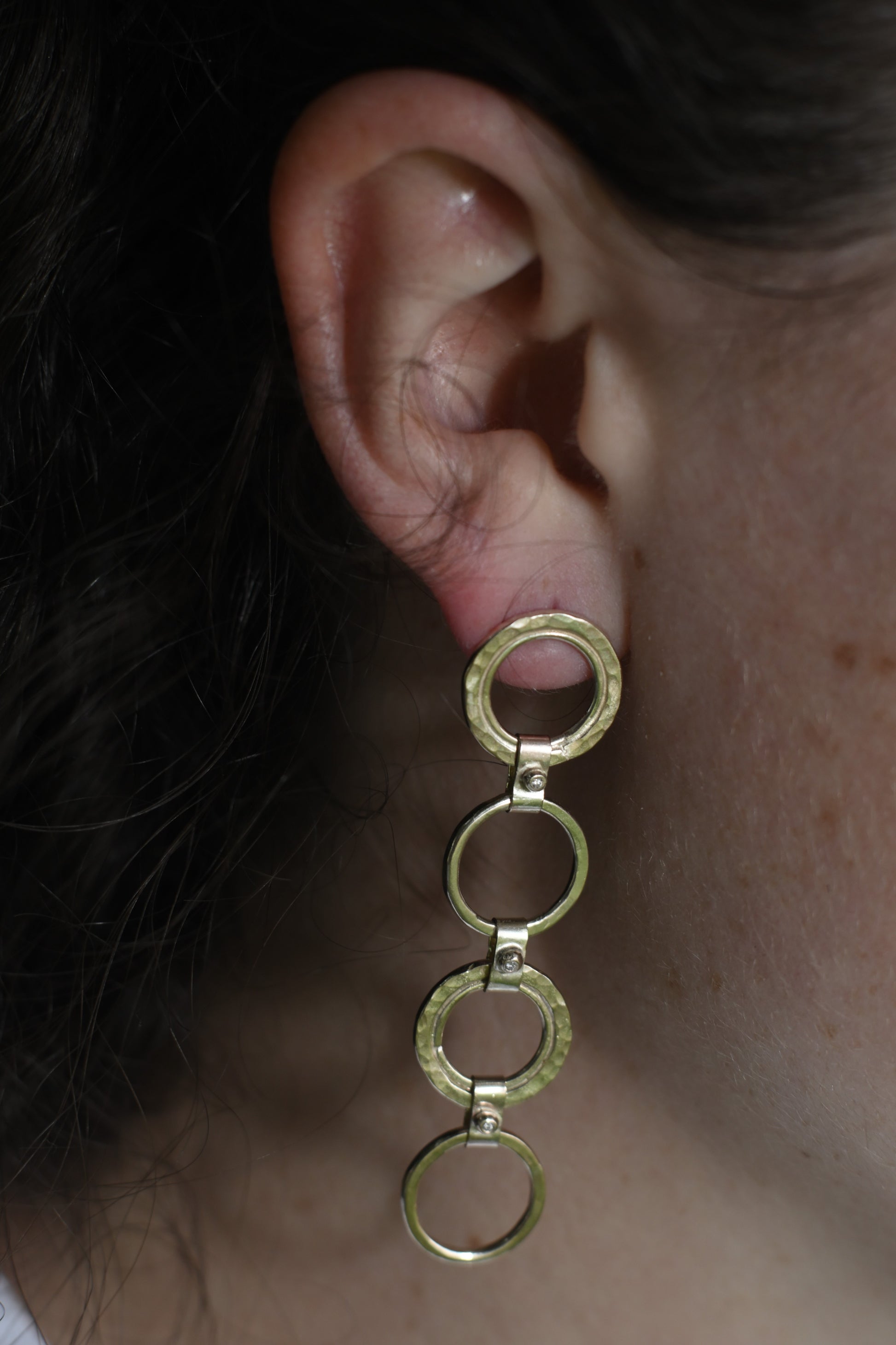 gold diamond drop earrings pictured on Madeleine. Handmade  fine jewellery.