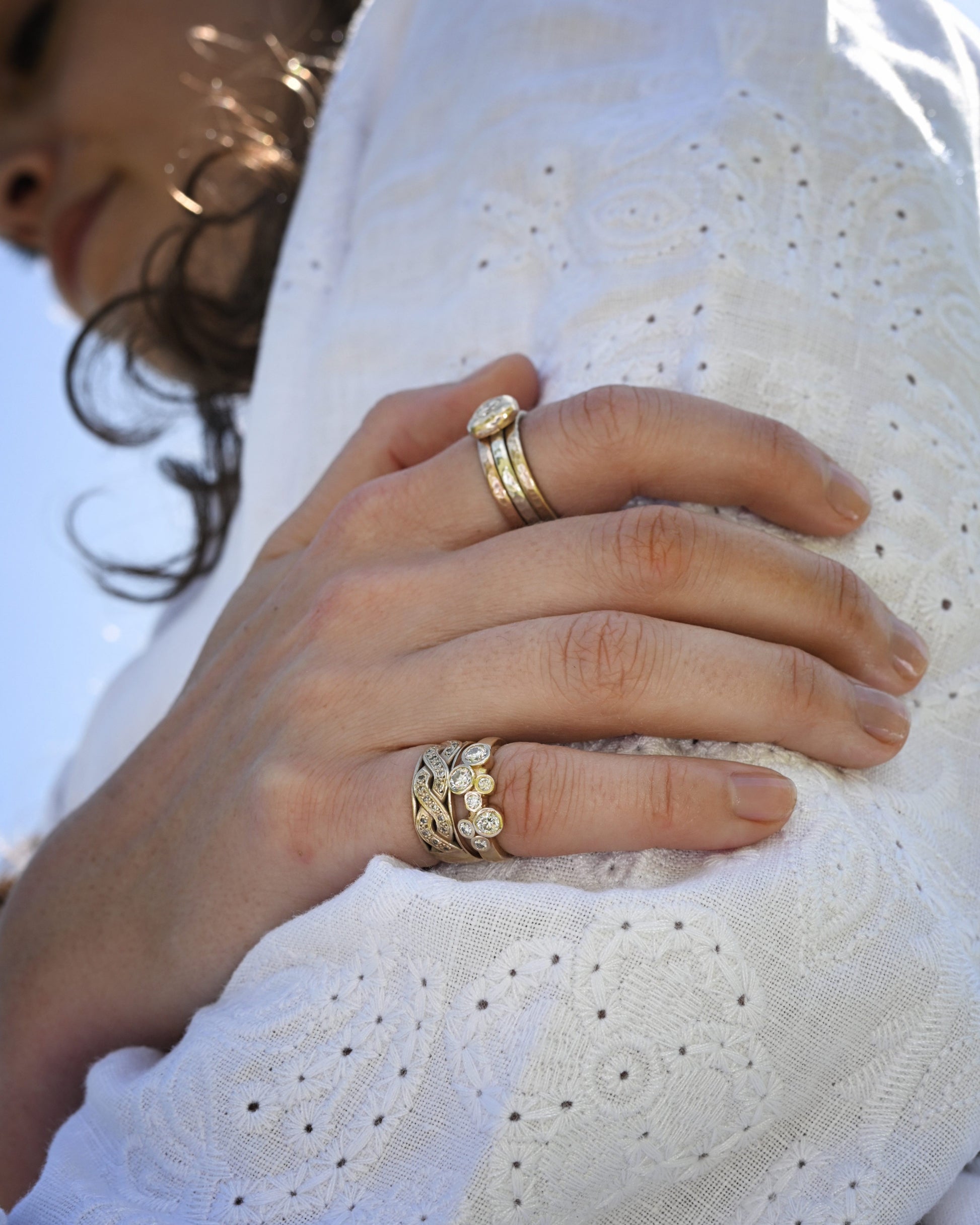 Madeleine wearing the yellow gold celtic diamond promise ring on her little finger.