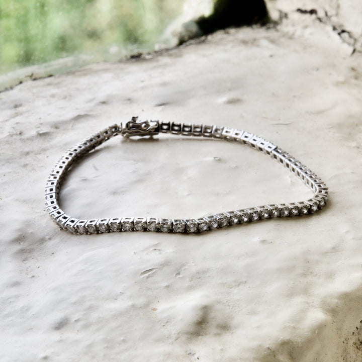 diamond tennis bracelet pictured on white brick in the Cotswold&